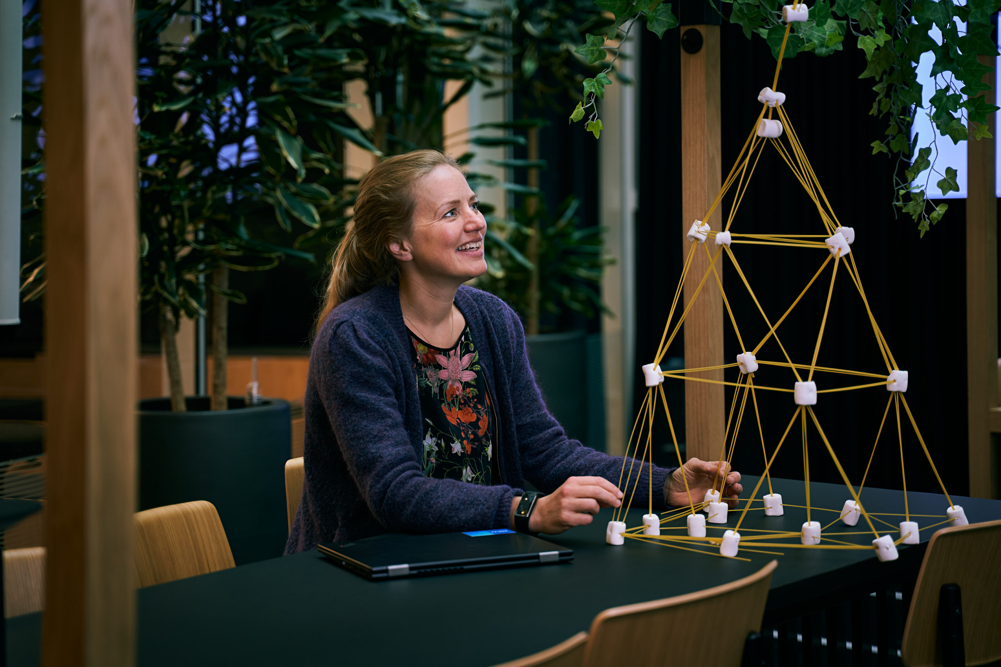 Camilla Moe, Mer, sits in casual office space