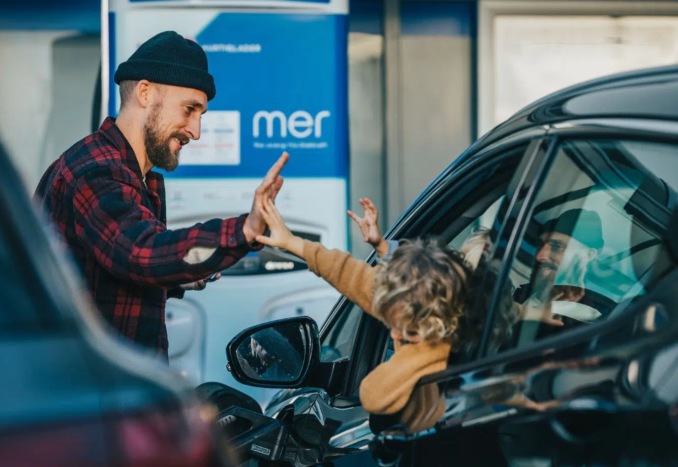 Man with Child at Mer UK Public Charging