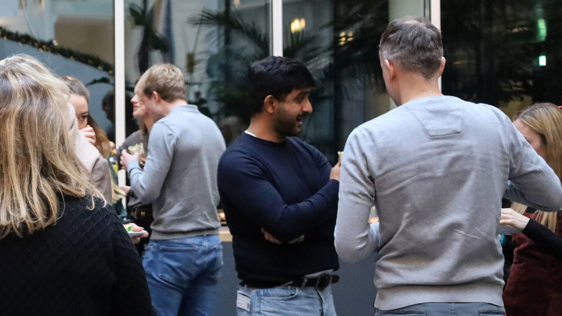Group of employees engaging in conversation
