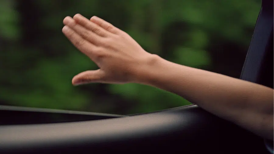 Young child's hand mimicking an aeroplane