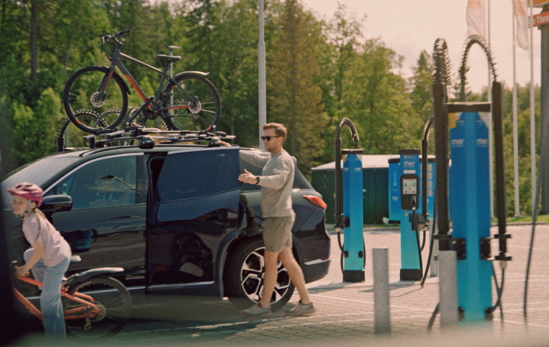 young-family-charging-electric-car